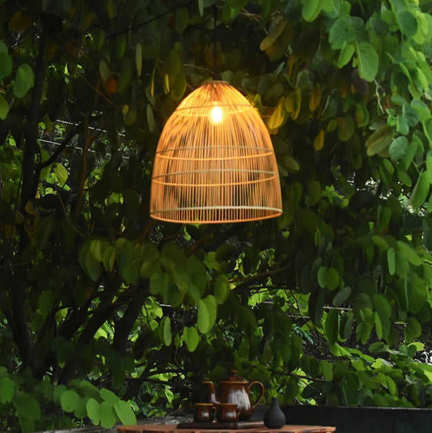 Aura Bamboo Pendant Light Suspended in a Natural Setting