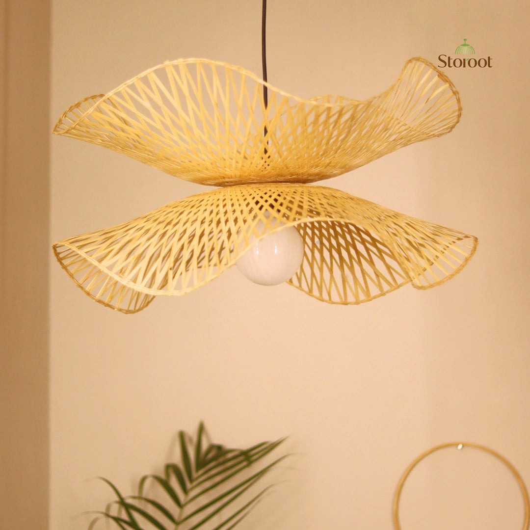 Woven Bamboo pendant light fixture on a beige wall with 'Storoot' branding.