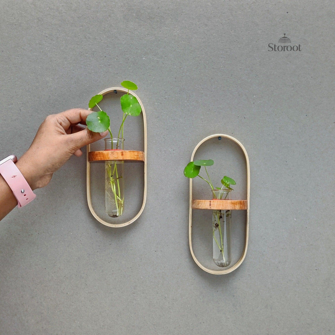 Girl caring for plants in a bamboo wall hanging planter