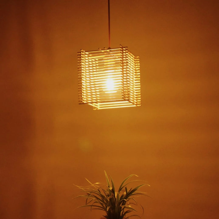 Warm ambiance of LightNest Square Bamboo Pendant Light - A beautiful, glowing light casting a soft, warm ambiance in a room