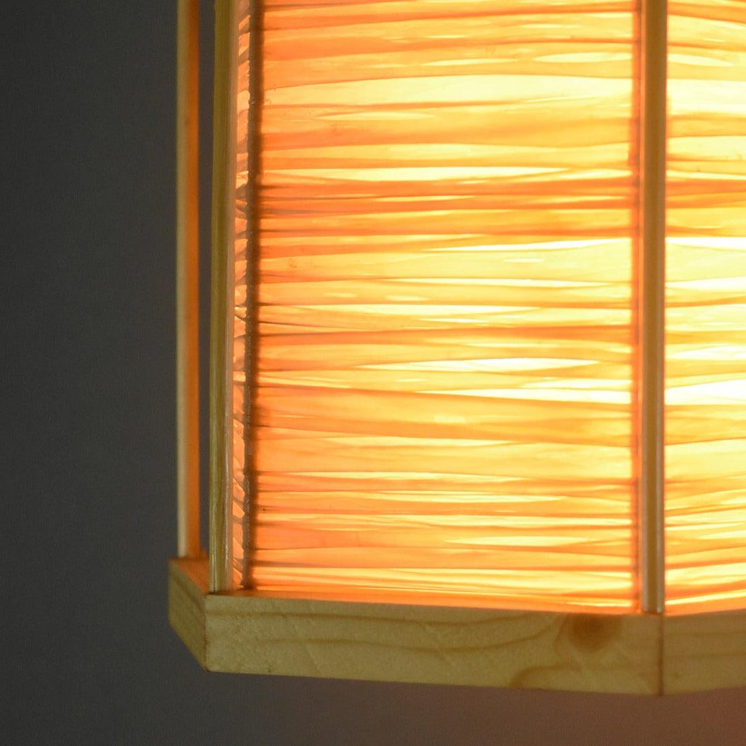 Close-up of honeycomb-inspired raffia and bamboo pendant light