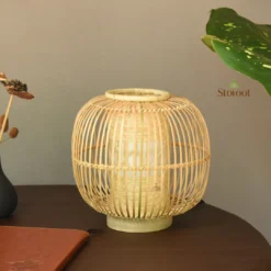 Eco-friendly bamboo bedside light with intricate weaving.